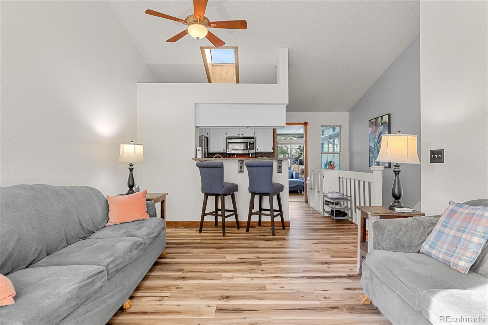 5323 East Sandpiper Avenue Castle Rock, CO 80104 - Photo 10 of 46 a living room with furniture and wooden floor