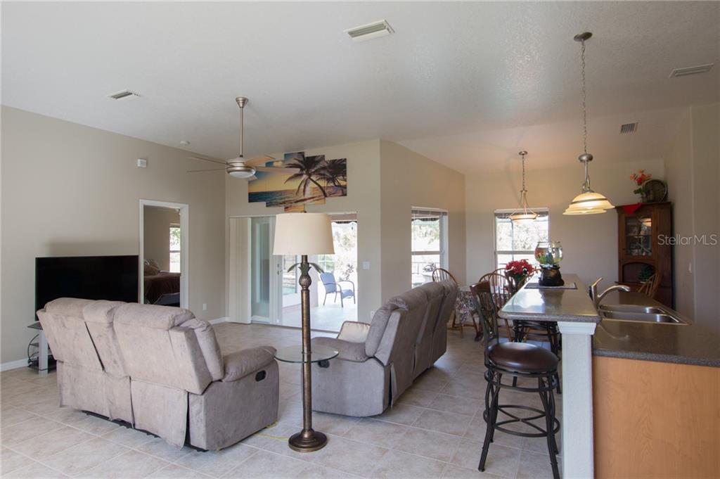 6612 Deer Run Road North Port, FL 34291 - Photo 8 of 25 Great room with eat at island/bar