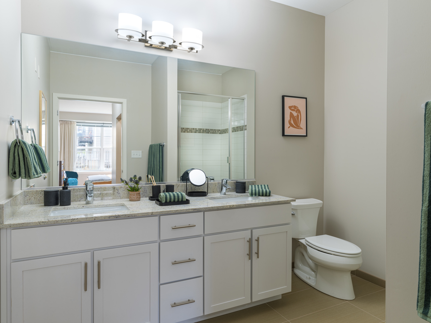 255 North Addison Avenue, Unit 632 Elmhurst, IL 60126 - Photo 4 of 19 a bathroom with a toilet a sink and mirror