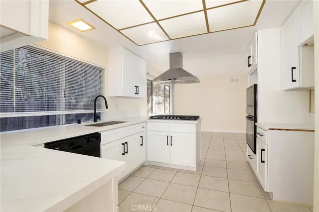 a view of a kitchen with furniture and a kitchen