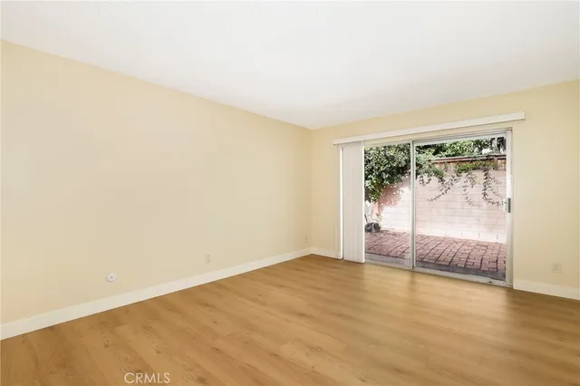 a spacious bathroom with a granite countertop sink and a mirror