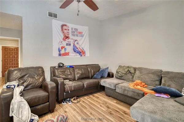 a living room with couches and a couch