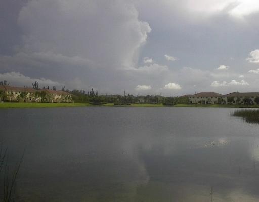 972 Imperial Lake Road West Palm Beach, FL 33413 - Photo 3 of 6 a view of a lake with houses in the back