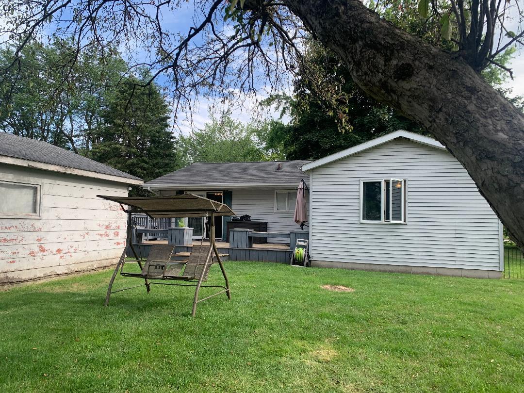 115 East Dresser Road DeKalb, IL 60115 - Photo 3 of 18 a backyard of a house with table and chairs