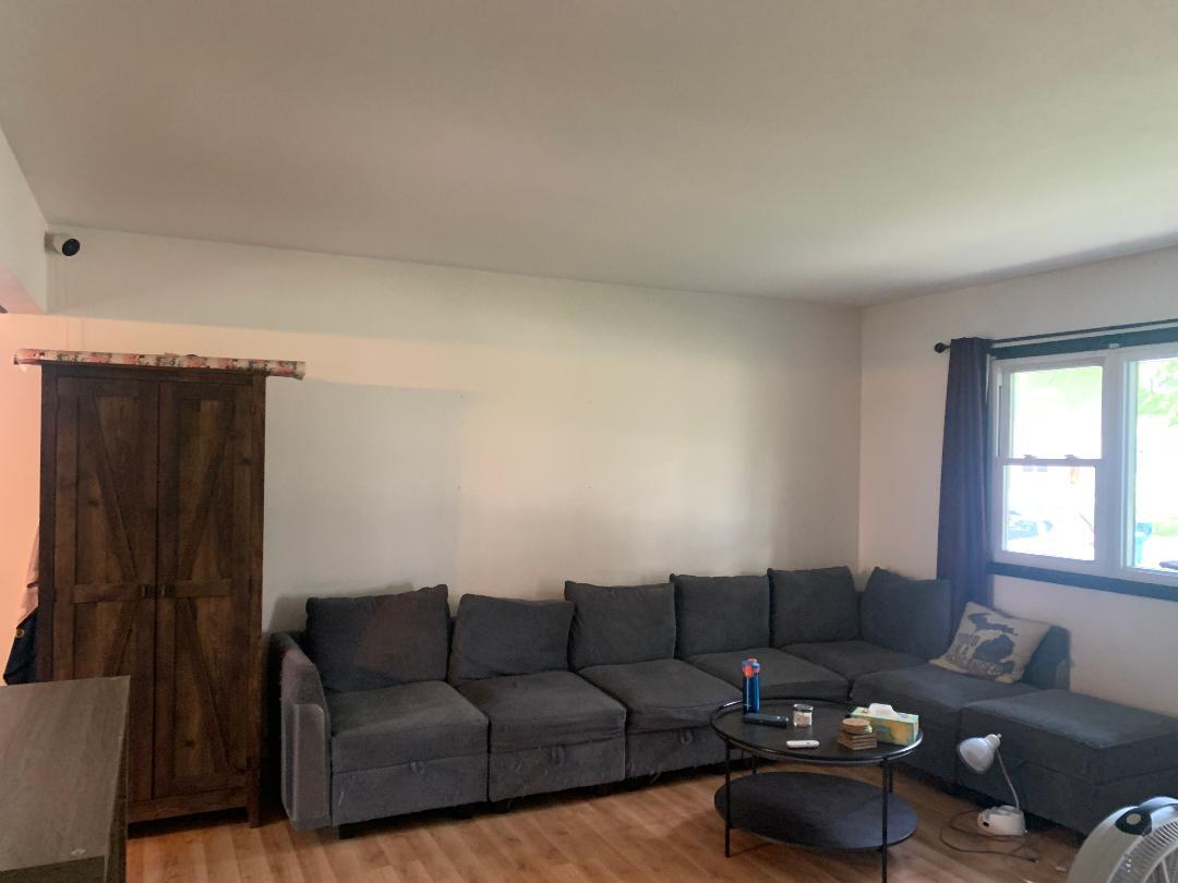 115 East Dresser Road DeKalb, IL 60115 - Photo 7 of 18 a living room with furniture and a window