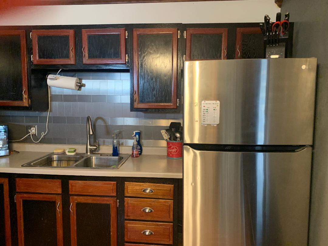 115 East Dresser Road DeKalb, IL 60115 - Photo 8 of 18 a white refrigerator freezer sitting in a kitchen