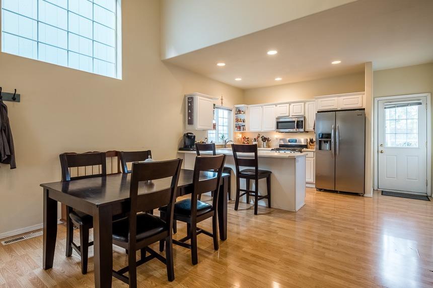667 Shadow Way Central Point, OR 97502 - Photo 8 of 26 a kitchen with refrigerator and chairs