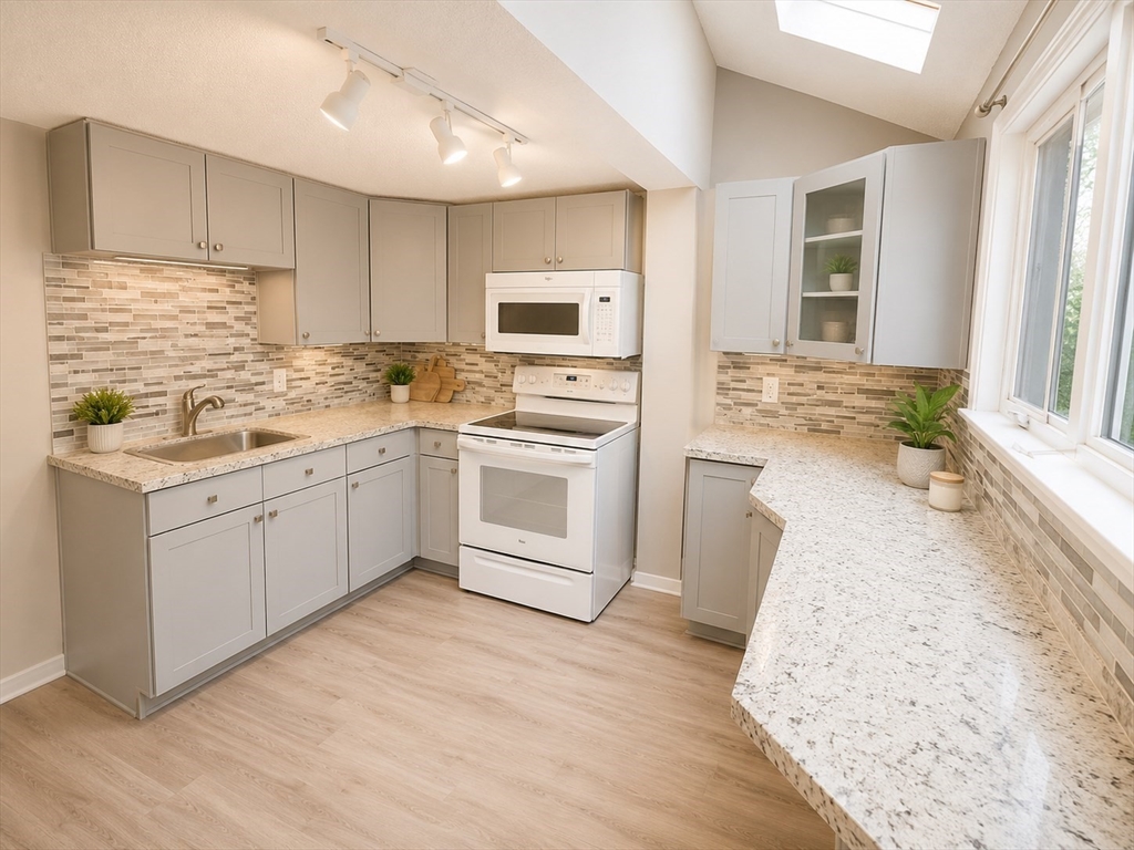 92-94 Sargent Street Leicester, MA 01611 - Photo 2 of 25 a kitchen with a sink stove and cabinets