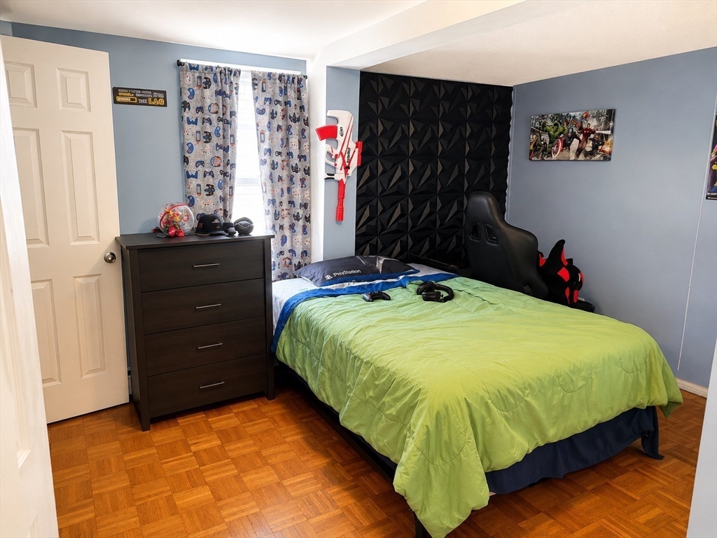 92-94 Sargent Street Leicester, MA 01611 - Photo 7 of 25 a bed sitting in a bedroom next to a window