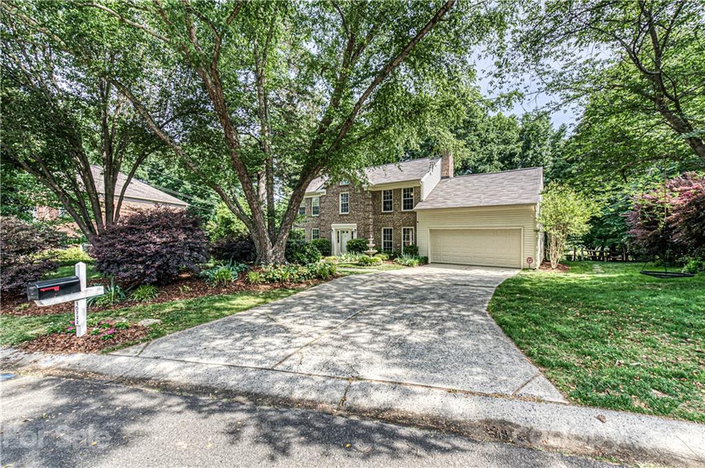10722 Fairway Ridge Road Charlotte, NC 28277 - Photo 1 of 44 a front view of a house with a yard and a garage