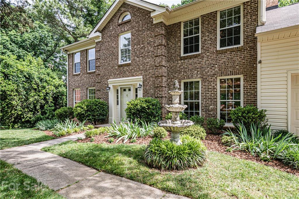 10722 Fairway Ridge Road Charlotte, NC 28277 - Photo 2 of 44 a view of house with a yard and potted plants