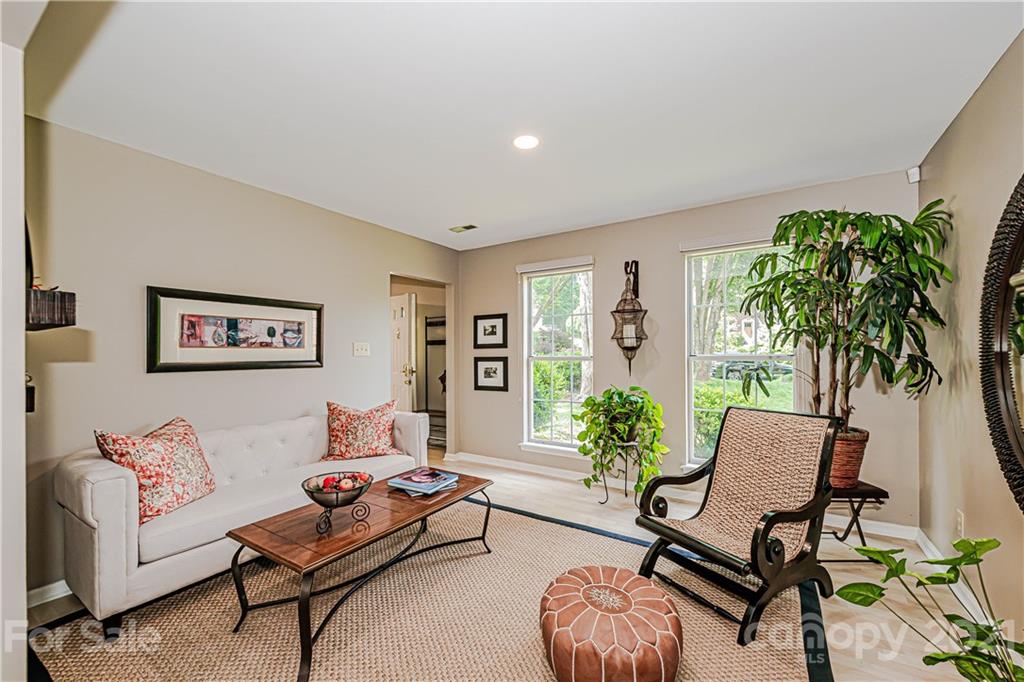 10722 Fairway Ridge Road Charlotte, NC 28277 - Photo 11 of 44 a living room with furniture and a potted plant