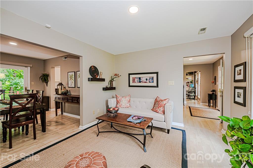 10722 Fairway Ridge Road Charlotte, NC 28277 - Photo 12 of 44 a living room with furniture and a large window