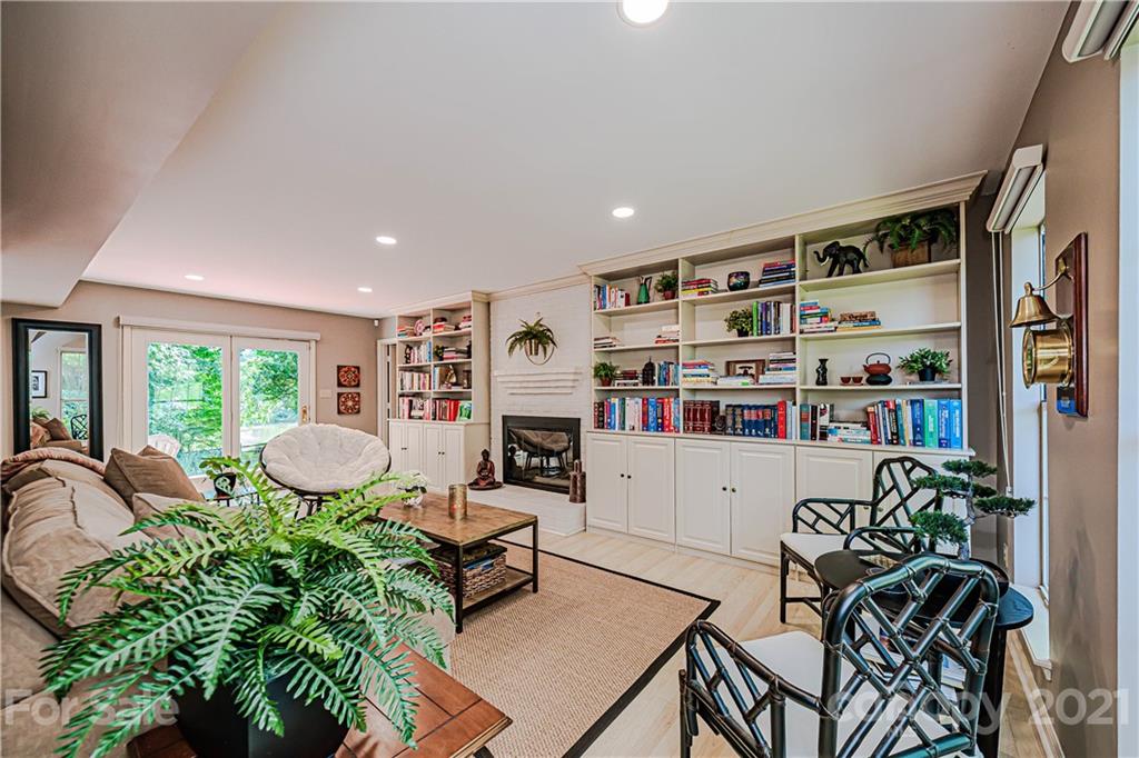 10722 Fairway Ridge Road Charlotte, NC 28277 - Photo 14 of 44 a room with furniture and a book shelf