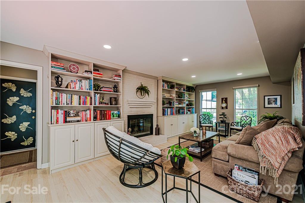 10722 Fairway Ridge Road Charlotte, NC 28277 - Photo 22 of 44 a living room with furniture and a fireplace