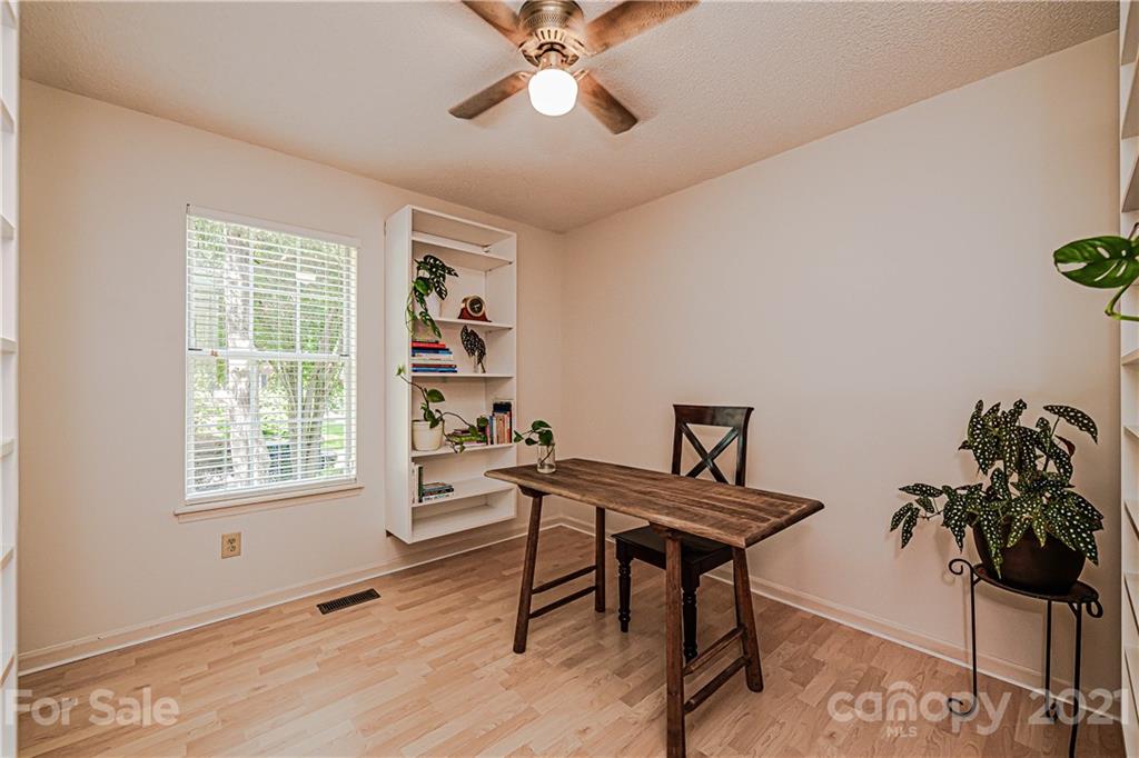 10722 Fairway Ridge Road Charlotte, NC 28277 - Photo 30 of 44 a workspace with furniture window and wooden floor