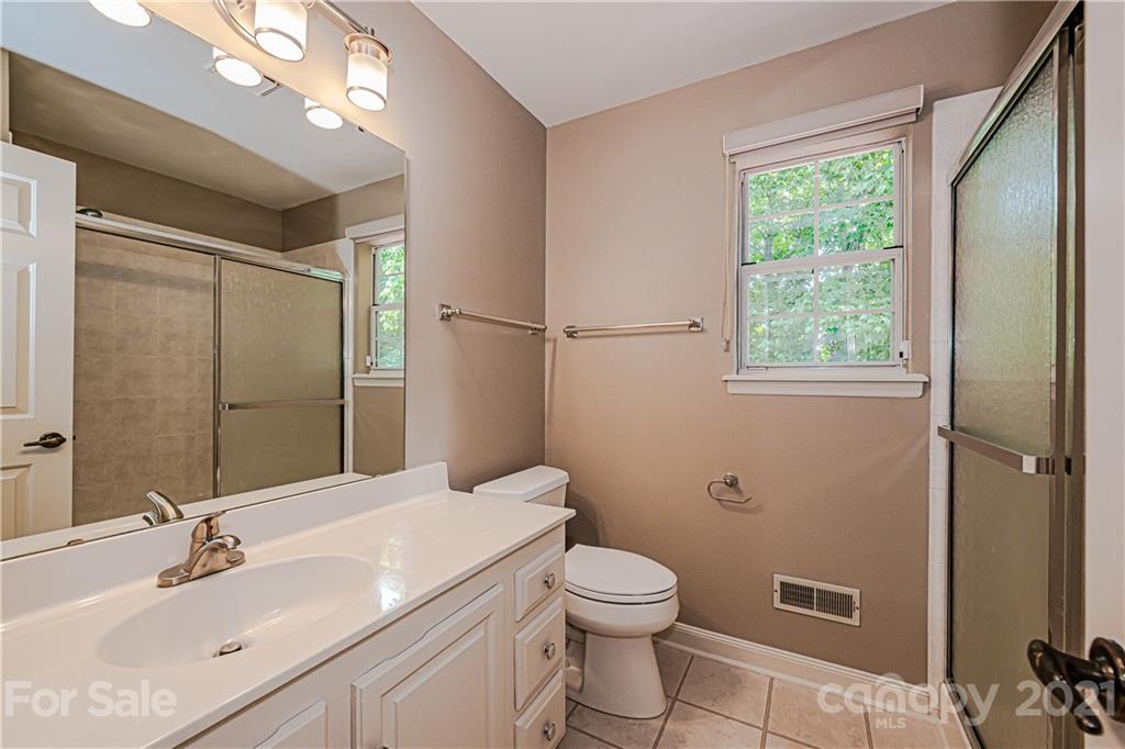 10722 Fairway Ridge Road Charlotte, NC 28277 - Photo 32 of 44 a bathroom with a sink toilet and shower