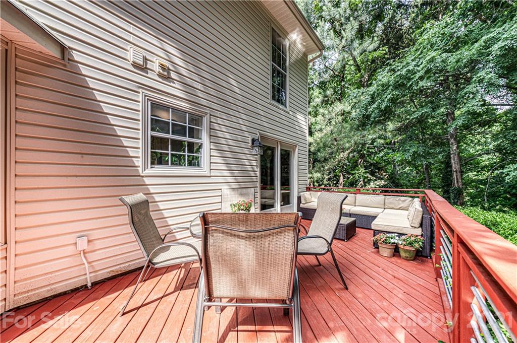 10722 Fairway Ridge Road Charlotte, NC 28277 - Photo 37 of 44 a view of a patio with table and chairs and wooden floor