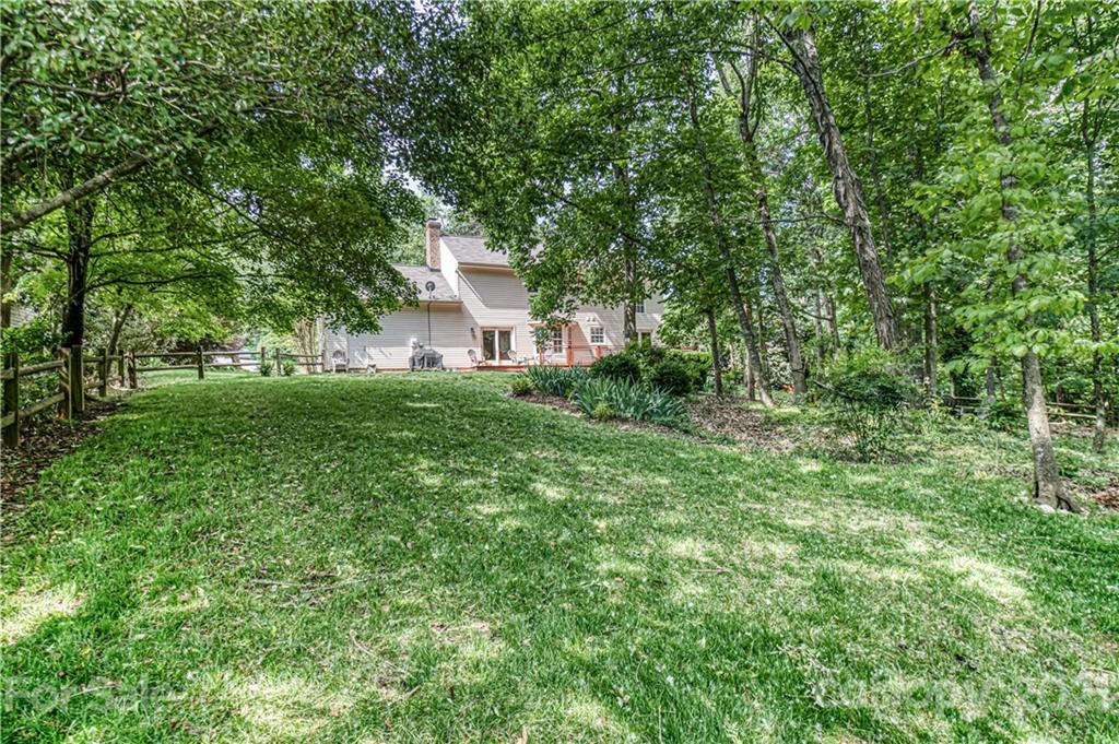10722 Fairway Ridge Road Charlotte, NC 28277 - Photo 40 of 44 a view of a house with a backyard