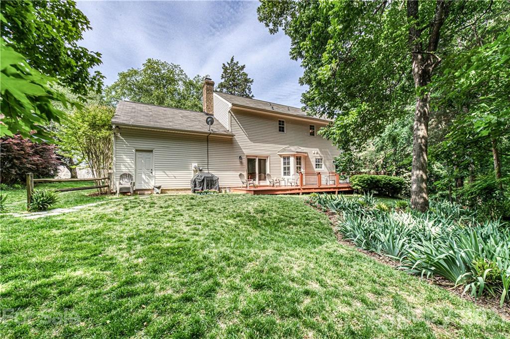 10722 Fairway Ridge Road Charlotte, NC 28277 - Photo 42 of 44 a view of a house with yard and a garden