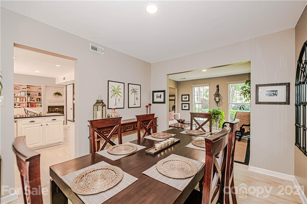 10722 Fairway Ridge Road Charlotte, NC 28277 - Photo 10 of 44 a dining room with furniture a rug and a dining table