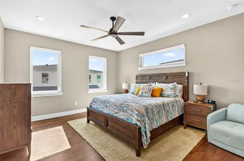 a bedroom with a bed and window