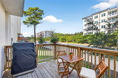 a view of a two chairs on the roof deck