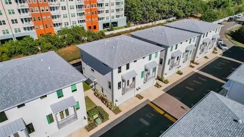 a view of multiple houses with a yard