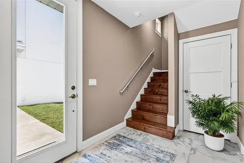 a view of entryway with stairs