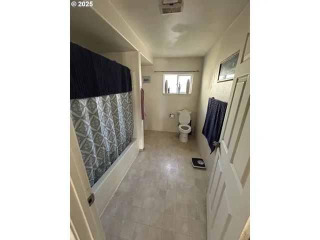 a view of a hardwood floor and wardrobe