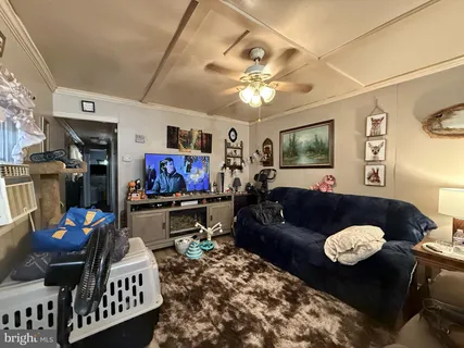 a living room with furniture and a table
