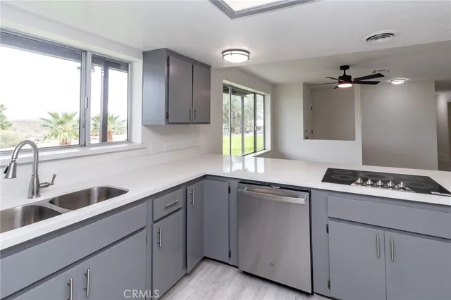 a kitchen that has a sink and a window