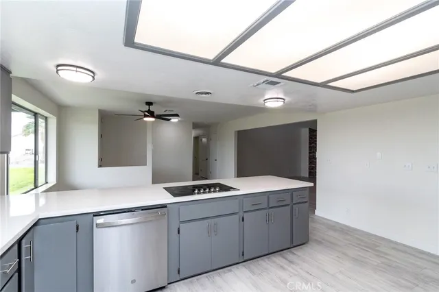a spacious bathroom with a granite countertop sink a mirror and a shower