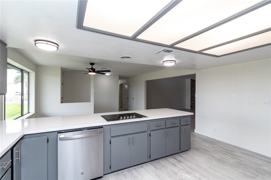 1507 David Drive Needles, CA 92363 - Photo 15 of 44 a spacious bathroom with a granite countertop sink a mirror and a shower