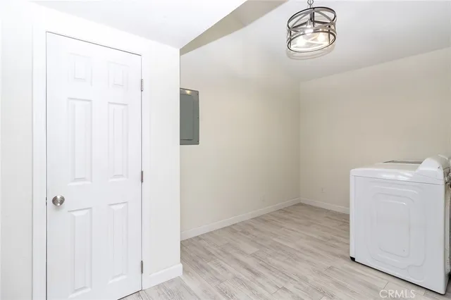 a view of a storage & utility room with a window