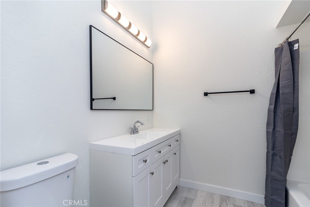 1507 David Drive Needles, CA 92363 - Photo 29 of 44 a bathroom with a toilet sink and mirror