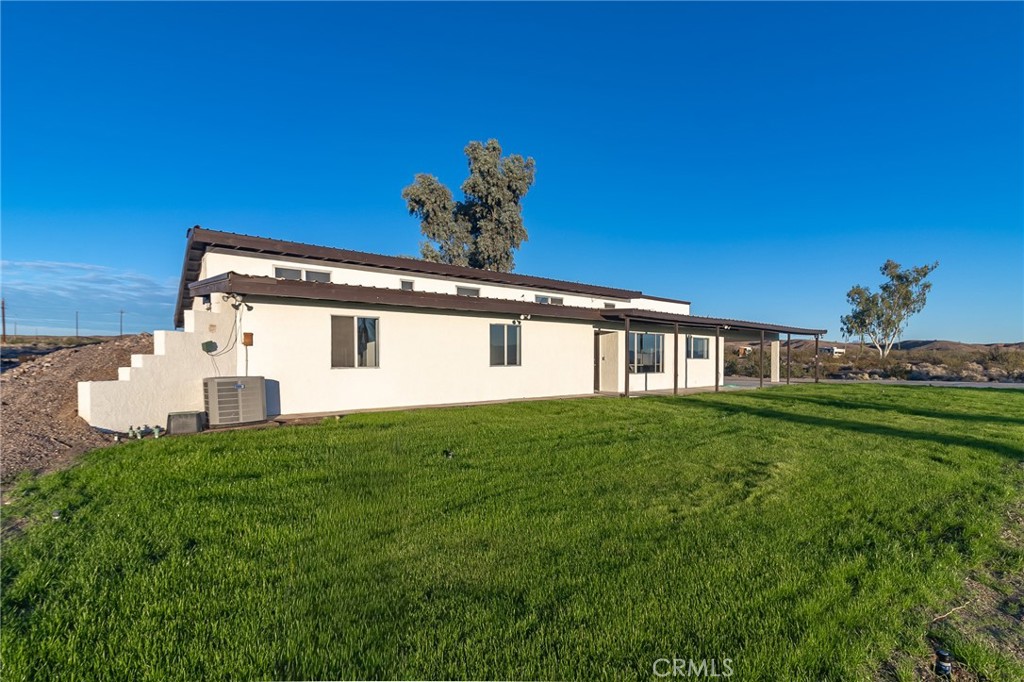 1507 David Drive Needles, CA 92363 - Photo 4 of 44 a front view of a house with a yard
