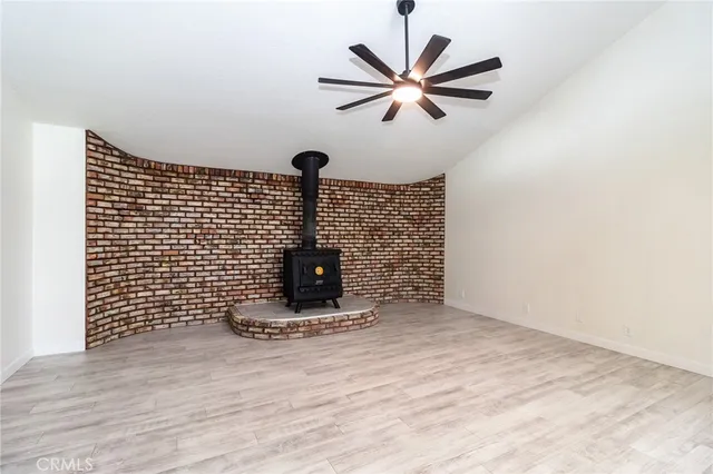 a view of a room with a wooden floor