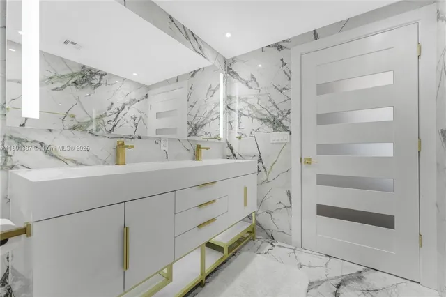 a bathroom with a sink and a shower