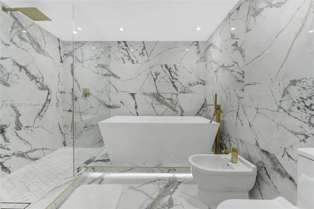 a white bath tub sitting in a bathroom