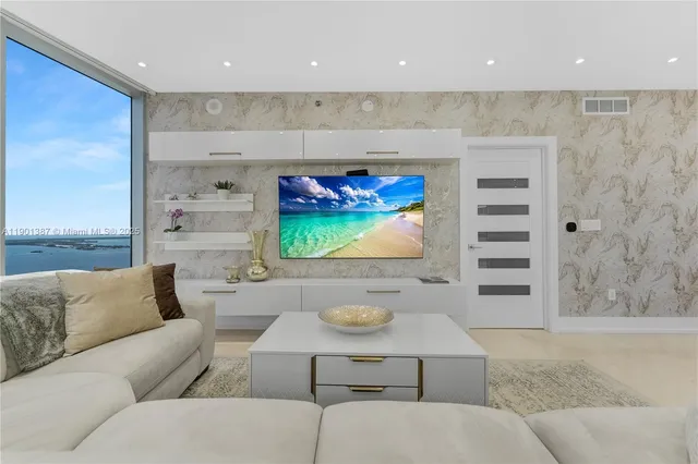 a living room with furniture and a rug