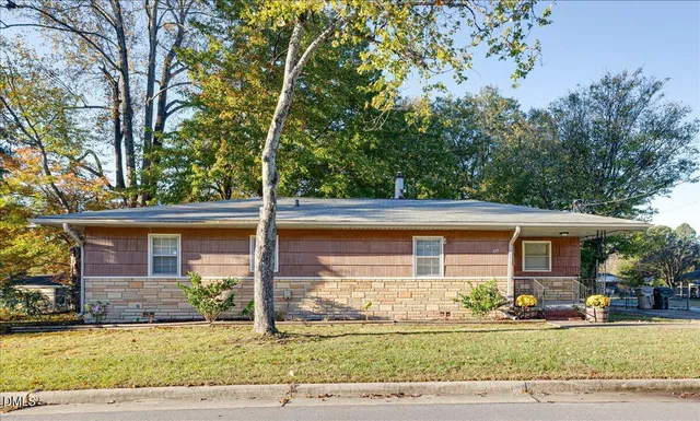a front view of a house with a yard