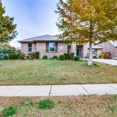 a view of a yard in front of a house