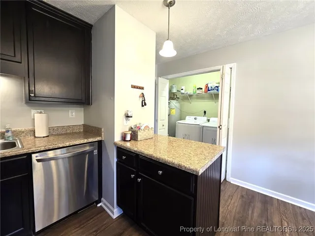 a kitchen with a sink and a microwave