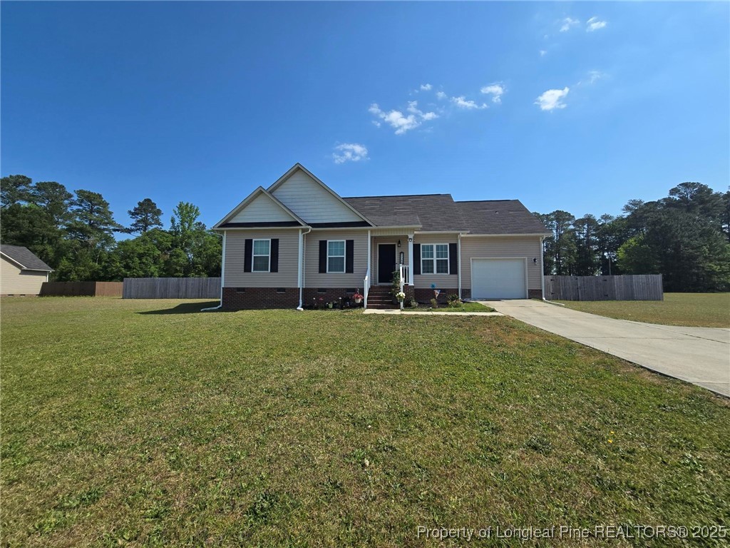 5345 Pittman Grove Church Road Raeford, NC 28376 - Photo 2 of 45 a house with garden in front of it