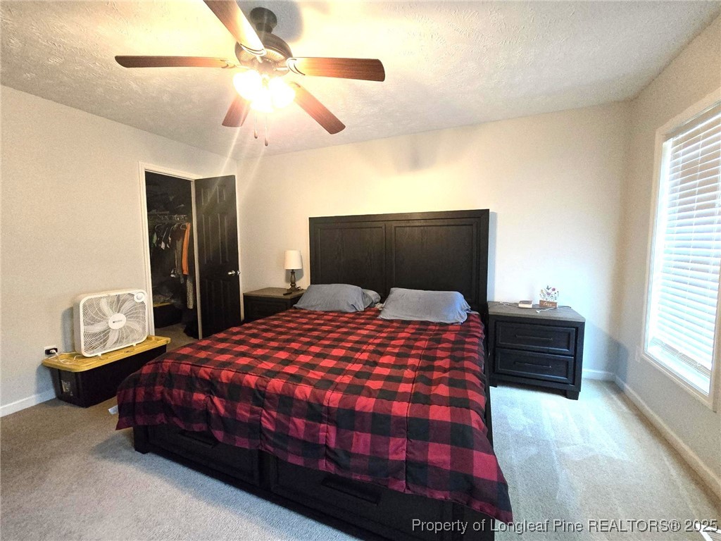 5345 Pittman Grove Church Road Raeford, NC 28376 - Photo 24 of 45 a bedroom with a bed and wooden floor