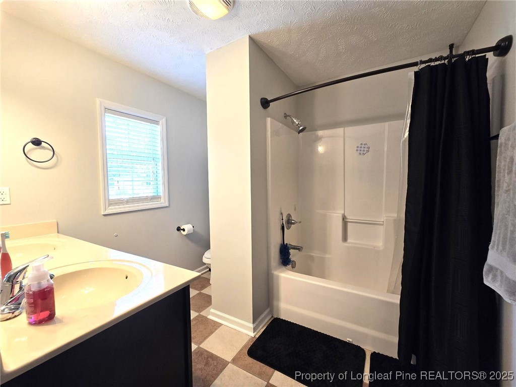 5345 Pittman Grove Church Road Raeford, NC 28376 - Photo 27 of 45 a bathroom with a bathtub and a shower
