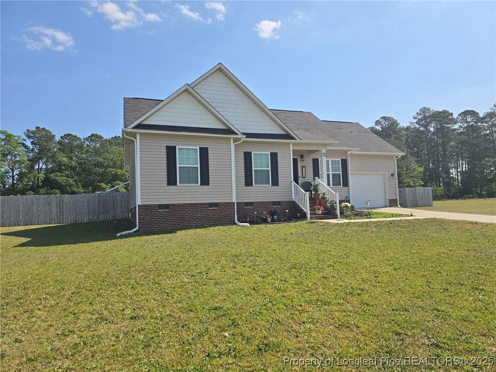 5345 Pittman Grove Church Road Raeford, NC 28376 - Photo 3 of 45 a front view of a house with swimming pool