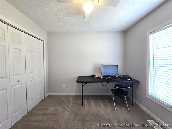 a workspace with furniture and window