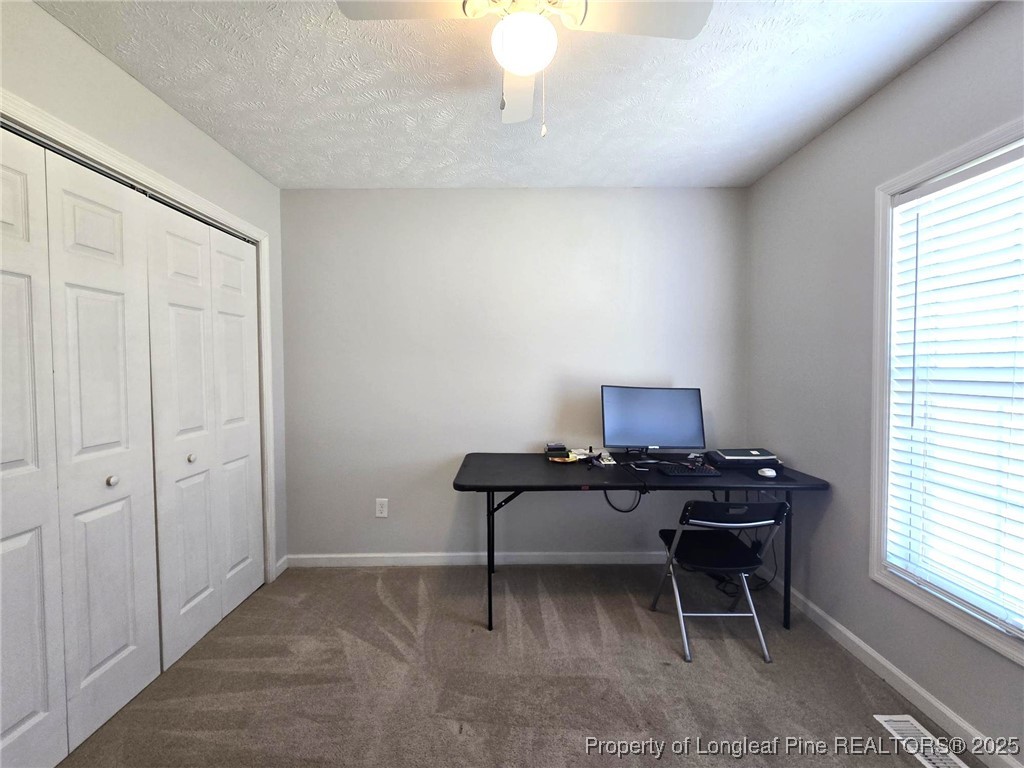 5345 Pittman Grove Church Road Raeford, NC 28376 - Photo 31 of 45 a workspace with furniture and window